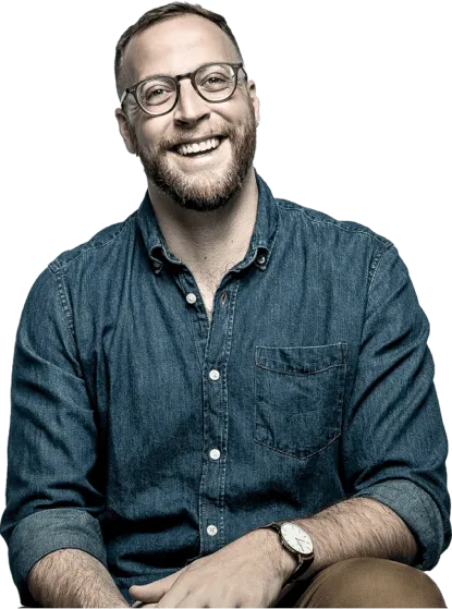 A man is smiling at the camera